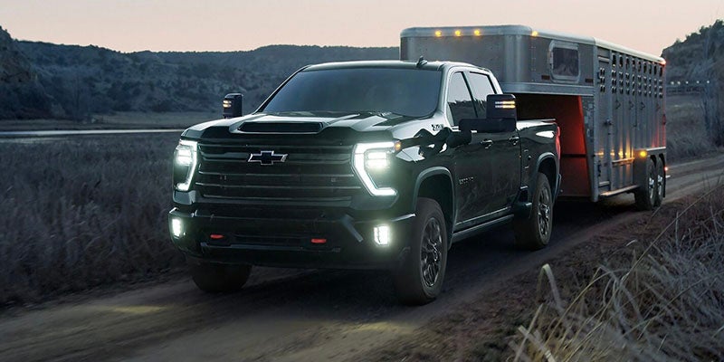 a 2026 Chevy Silverado 2500 HD pulls a trailer in Orange, CA
